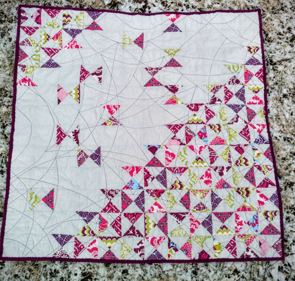 dancing quarter squares triangle quilt 