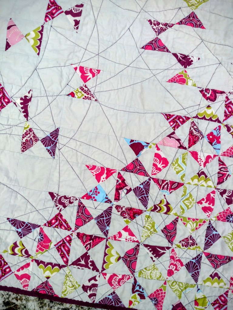 dancing quarter squares triangle quilt 