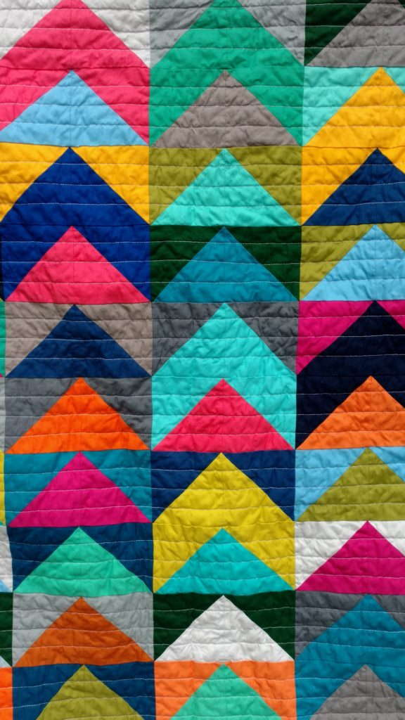 Kona solids baby quilt by quiltytherapy. #Half square triangle quilt #solids quilt #kona solids #HST quilt #modernbabyquilt