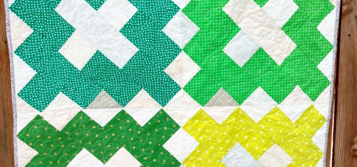scrappy green baby quilt