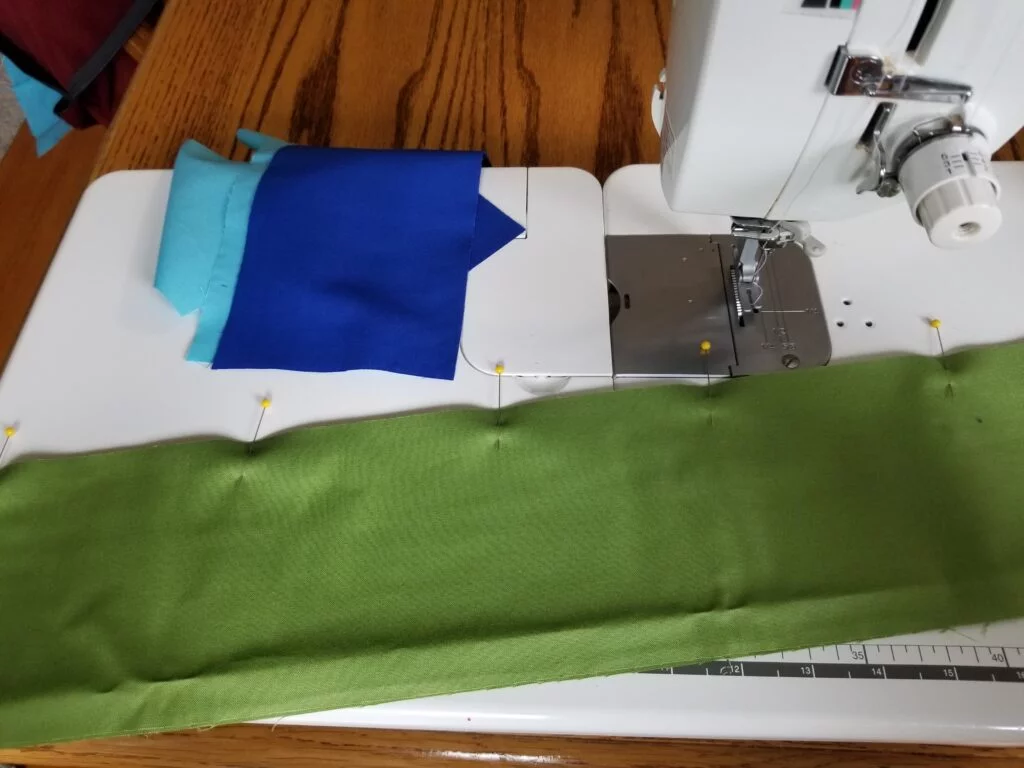 strips of fabric pinned together