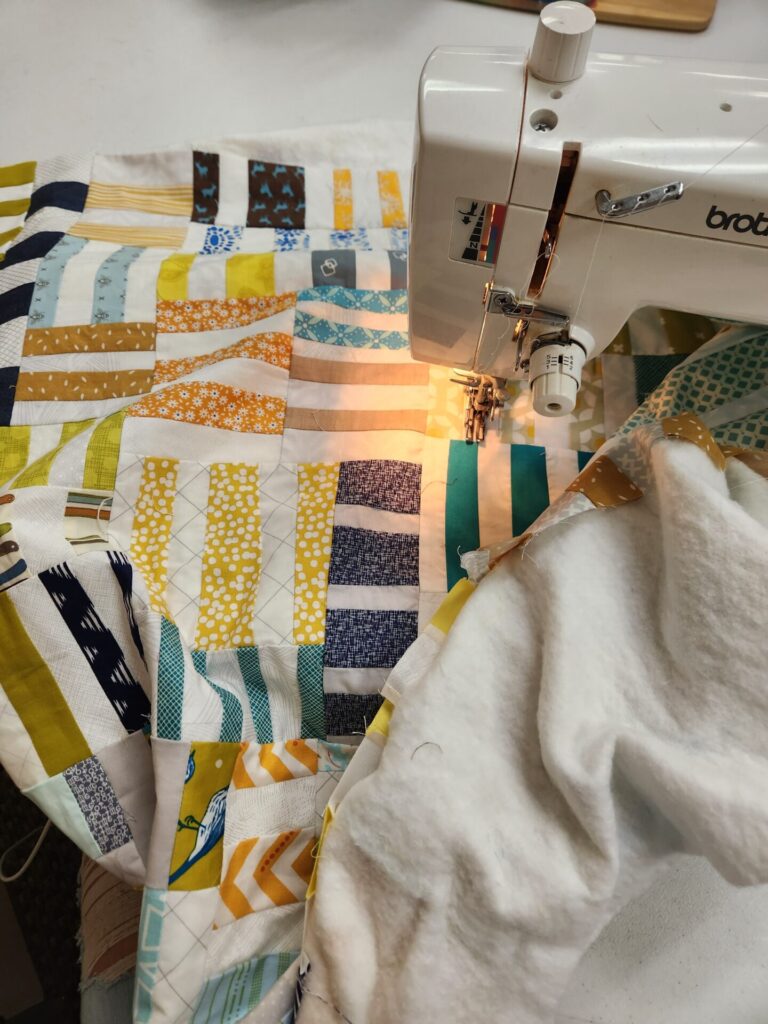 sewing machine with quilt